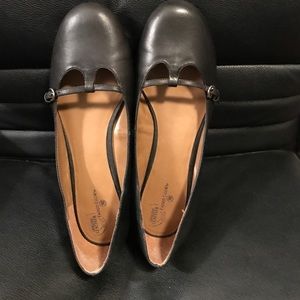 Black Mary-Jane flats.