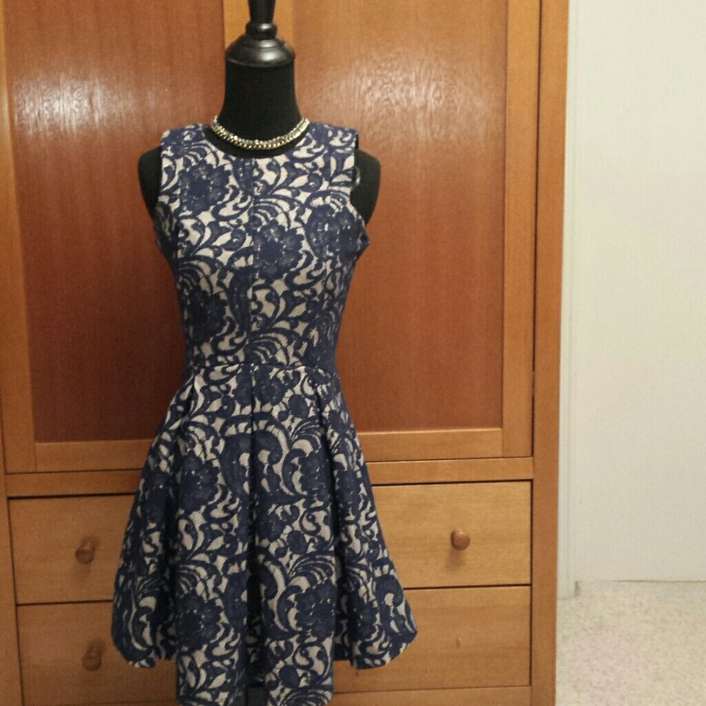 Cream colored dress with navy blue mesh print