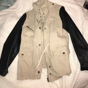 Beige coat with faux leather sleeves