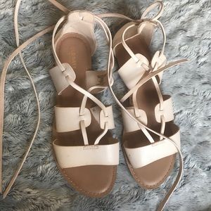Nude strap up sandal.
