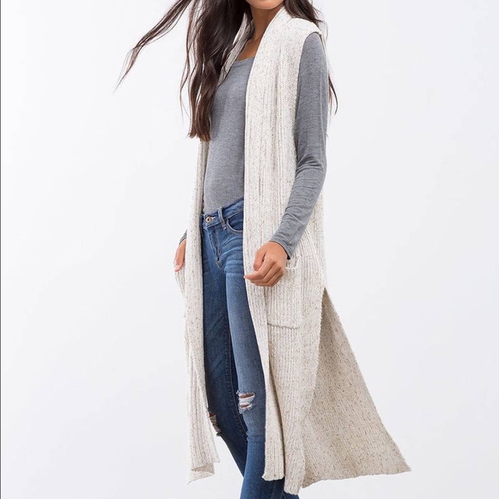 Longline sleeveless cardigan. New without tags.
