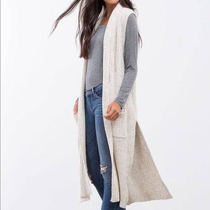 Longline sleeveless cardigan. New without tags.