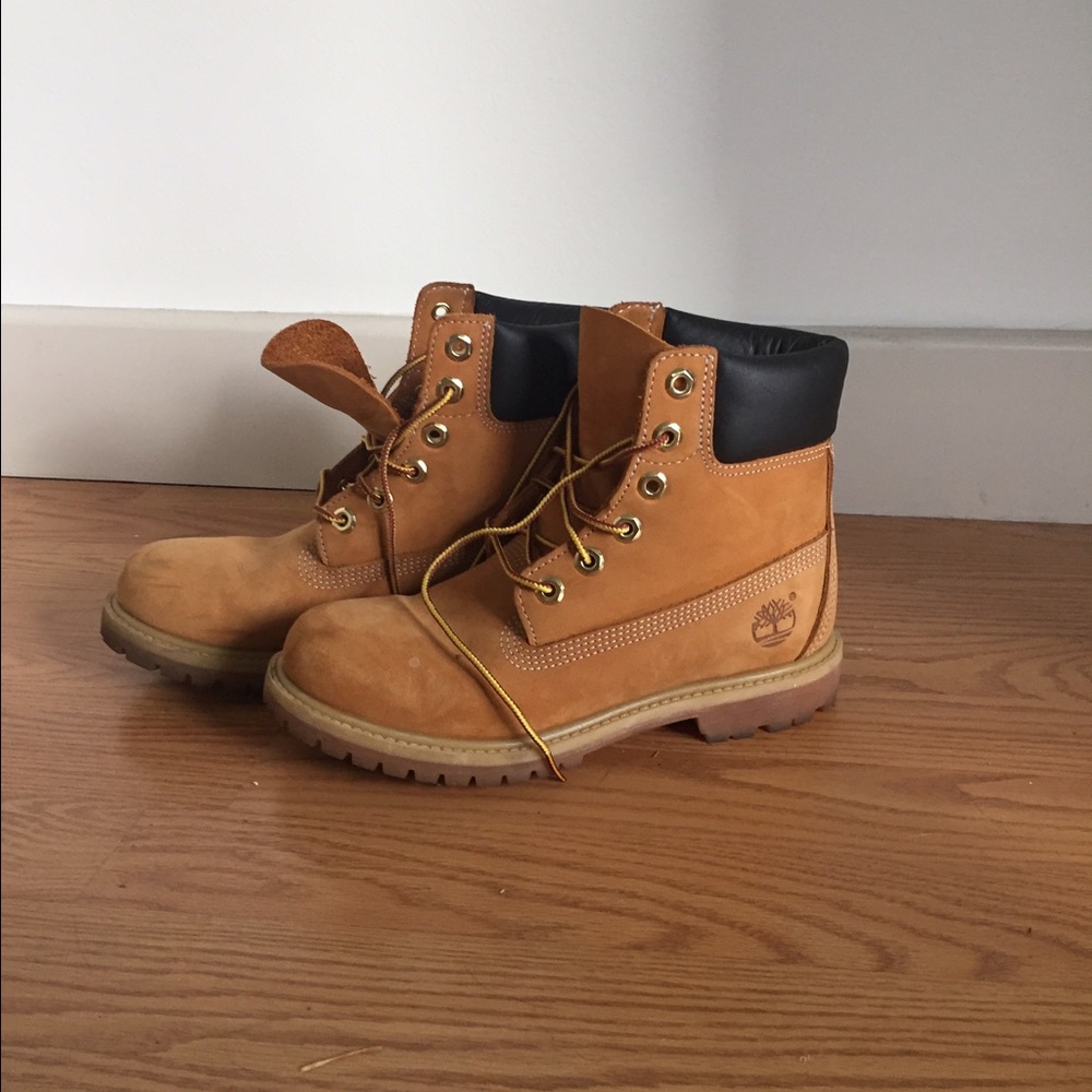 Brown and black timberland booties