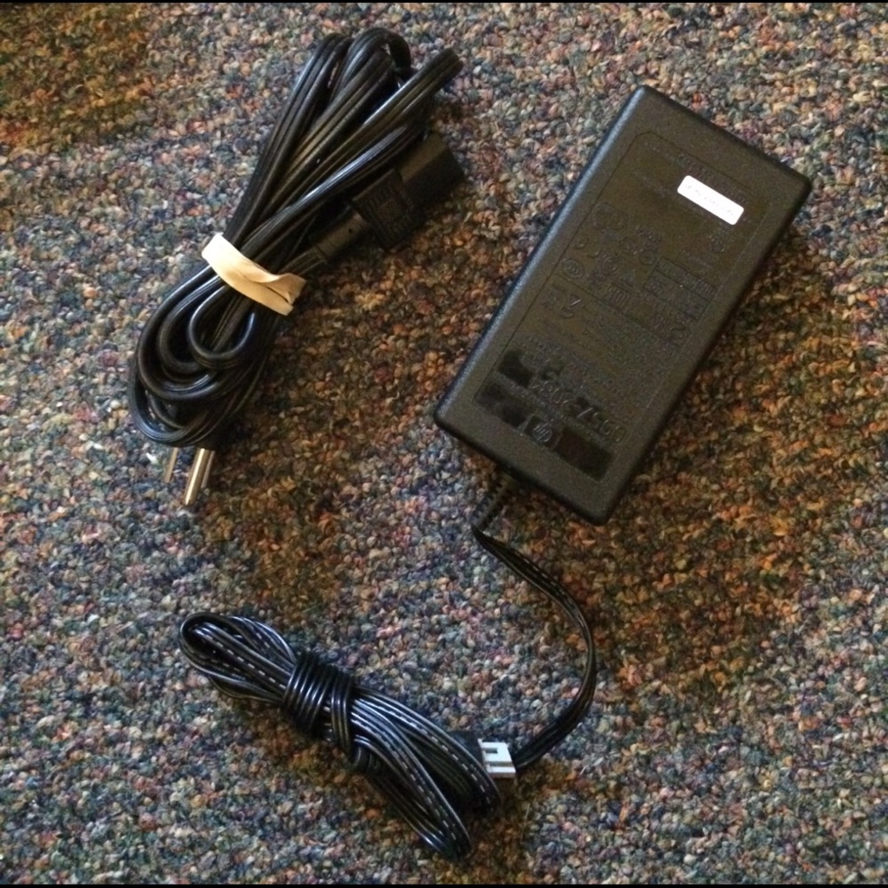 Never used!! AC/DC Power Adapter with packaging.