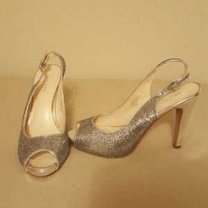 Nine West, peep toe, sling back pumps.