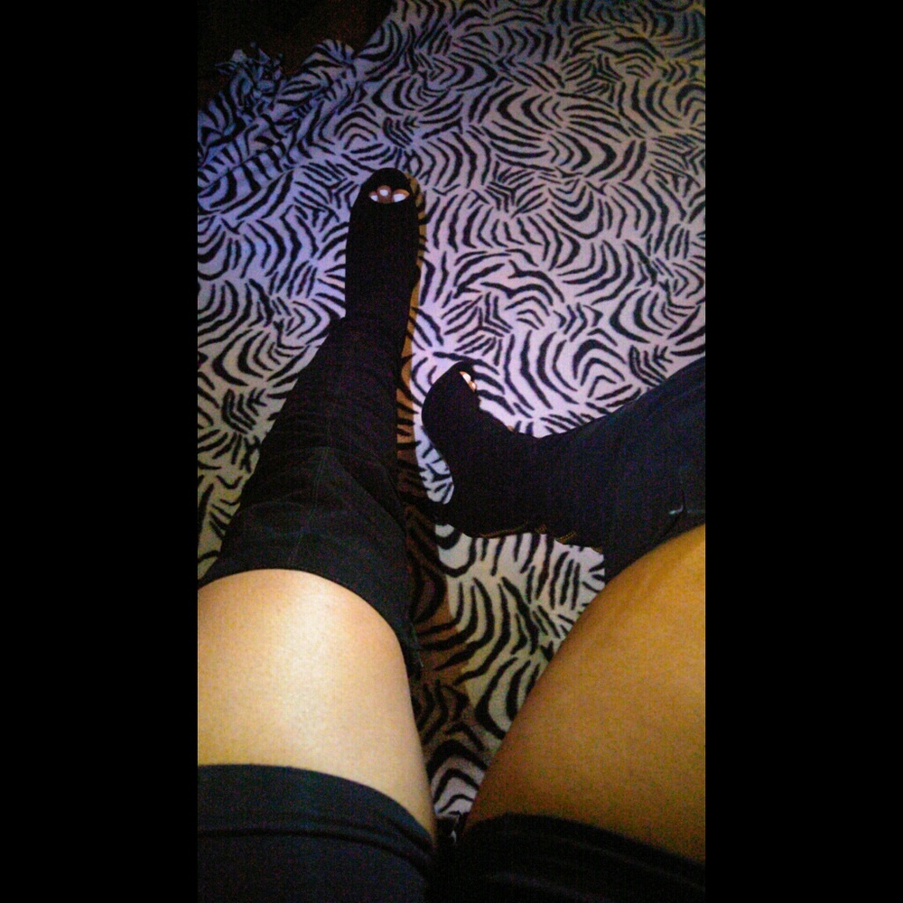 Black thigh high over the knee boots