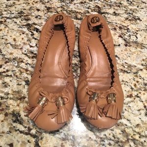 Tory Burch tasseled flats in tan