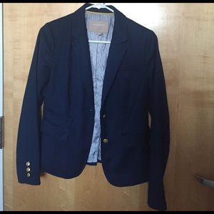 Navy blue blazer with gold buttons
