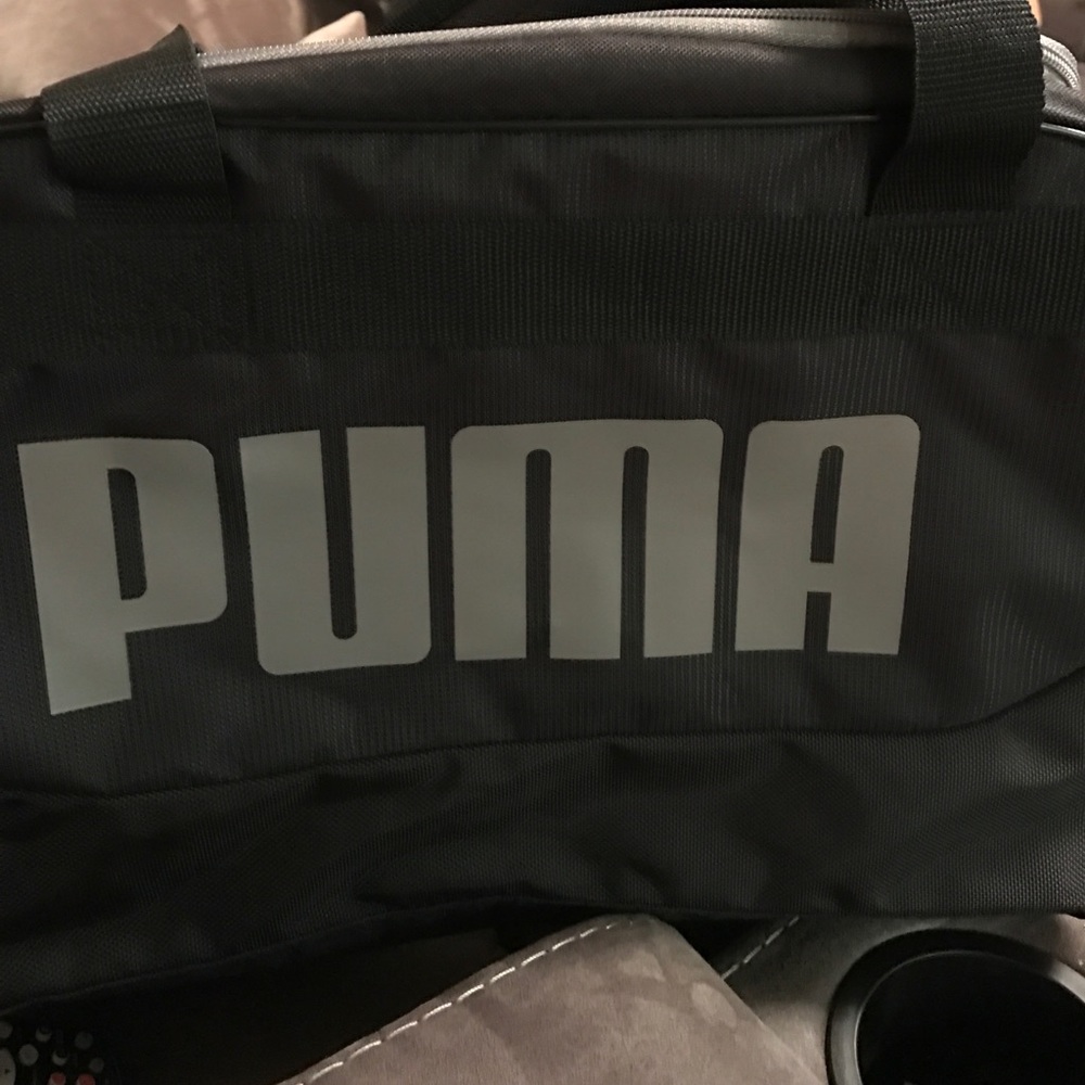 Black and grey puma duffle bag