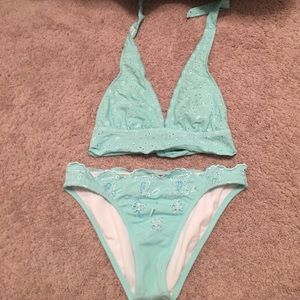 A mint colored bathing suit (M top and Lg bottom)