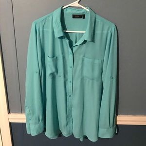 Teal colored blouse