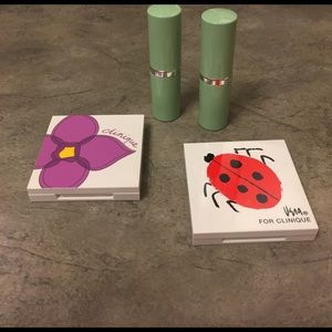 Two tubes of lipstick, and eyeshadow/blush kits