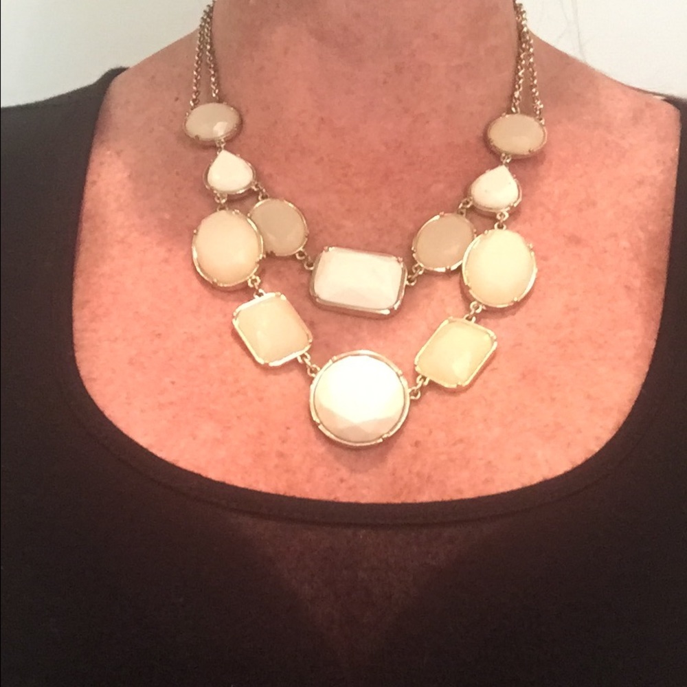 Tone on tone cream statement necklace.