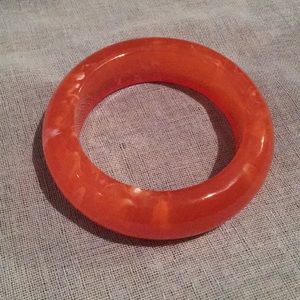 Large orange plastic bangle