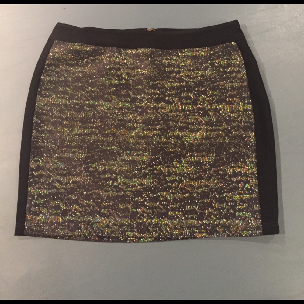 Never worn black and metallic mini skirt.