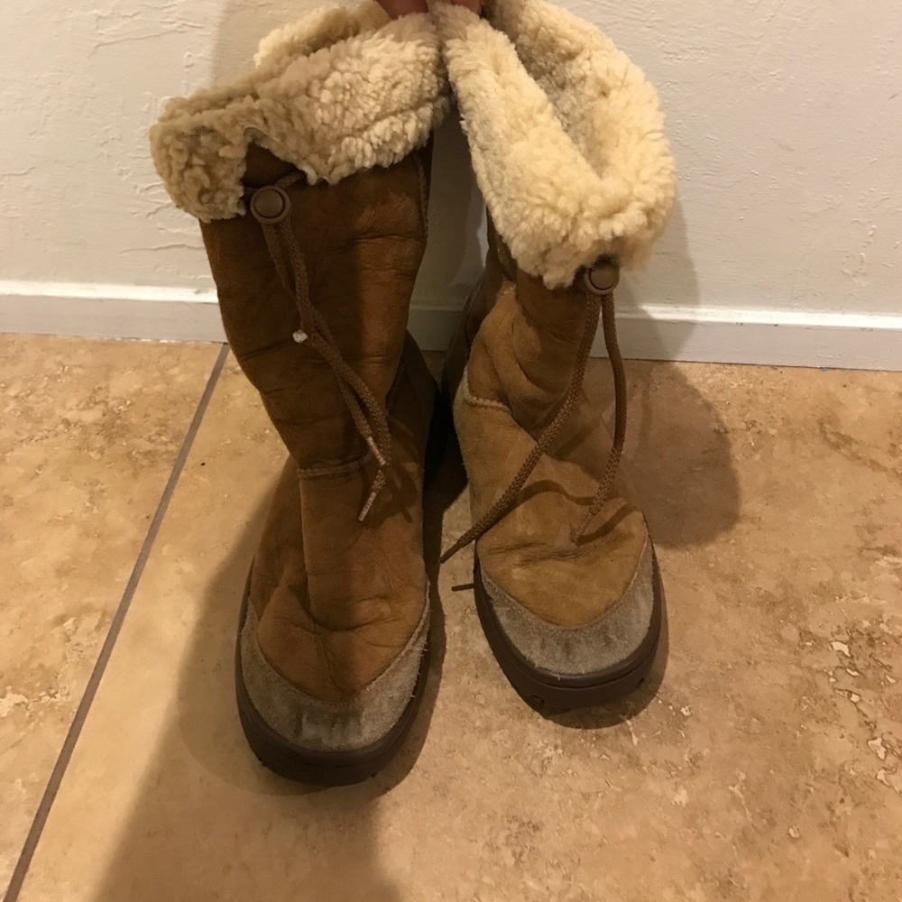 Tan uggs. Size w8
