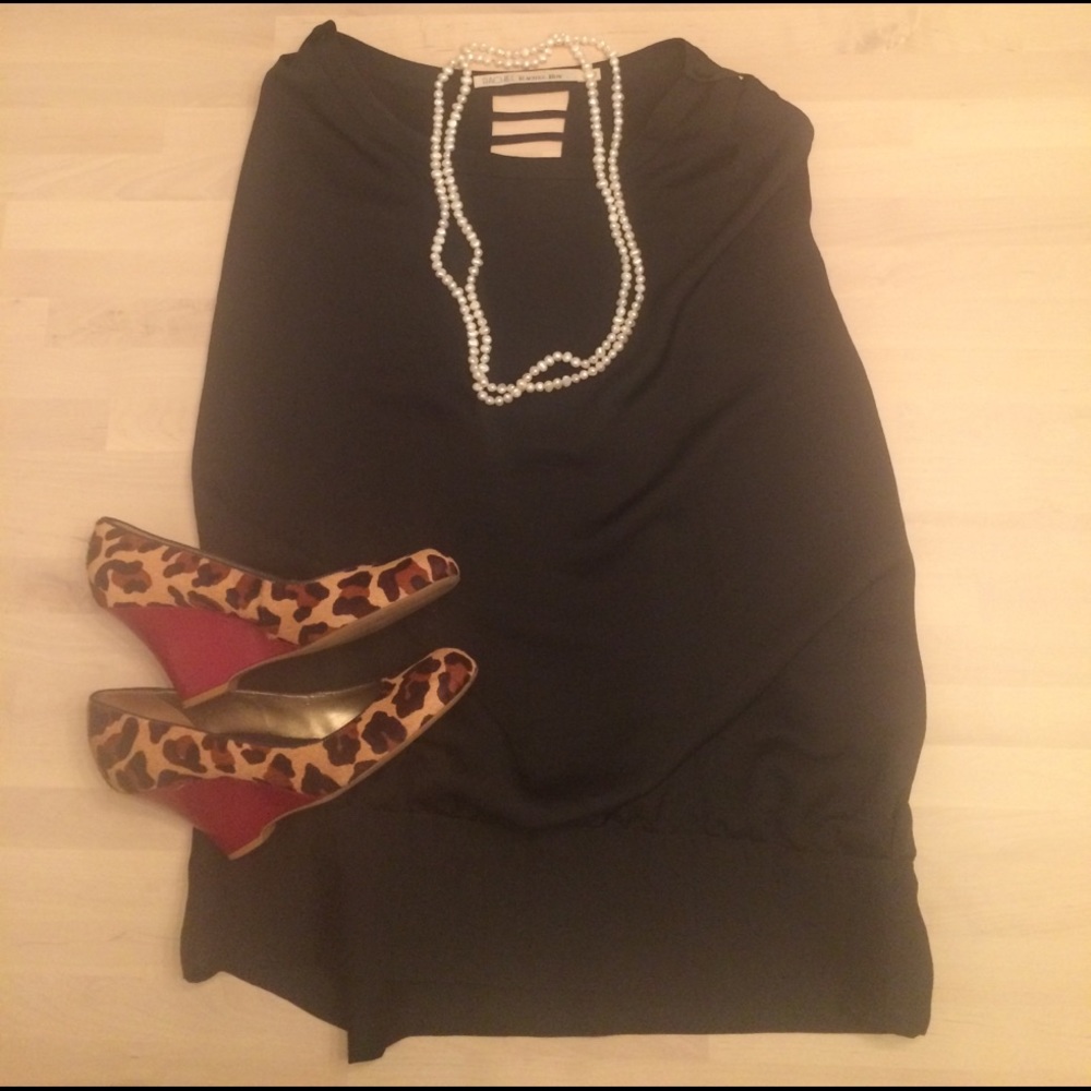 Black shell w cutout ladder detail all along back