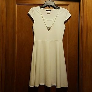White dress with gold necklace