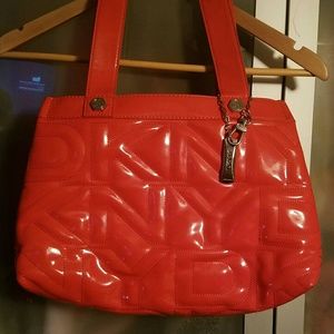 This has goy to go - Orange DKNY bag