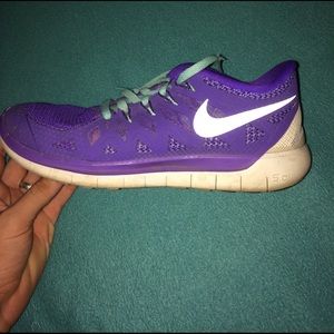 Purple and mint Nike free 5.0 shoes.