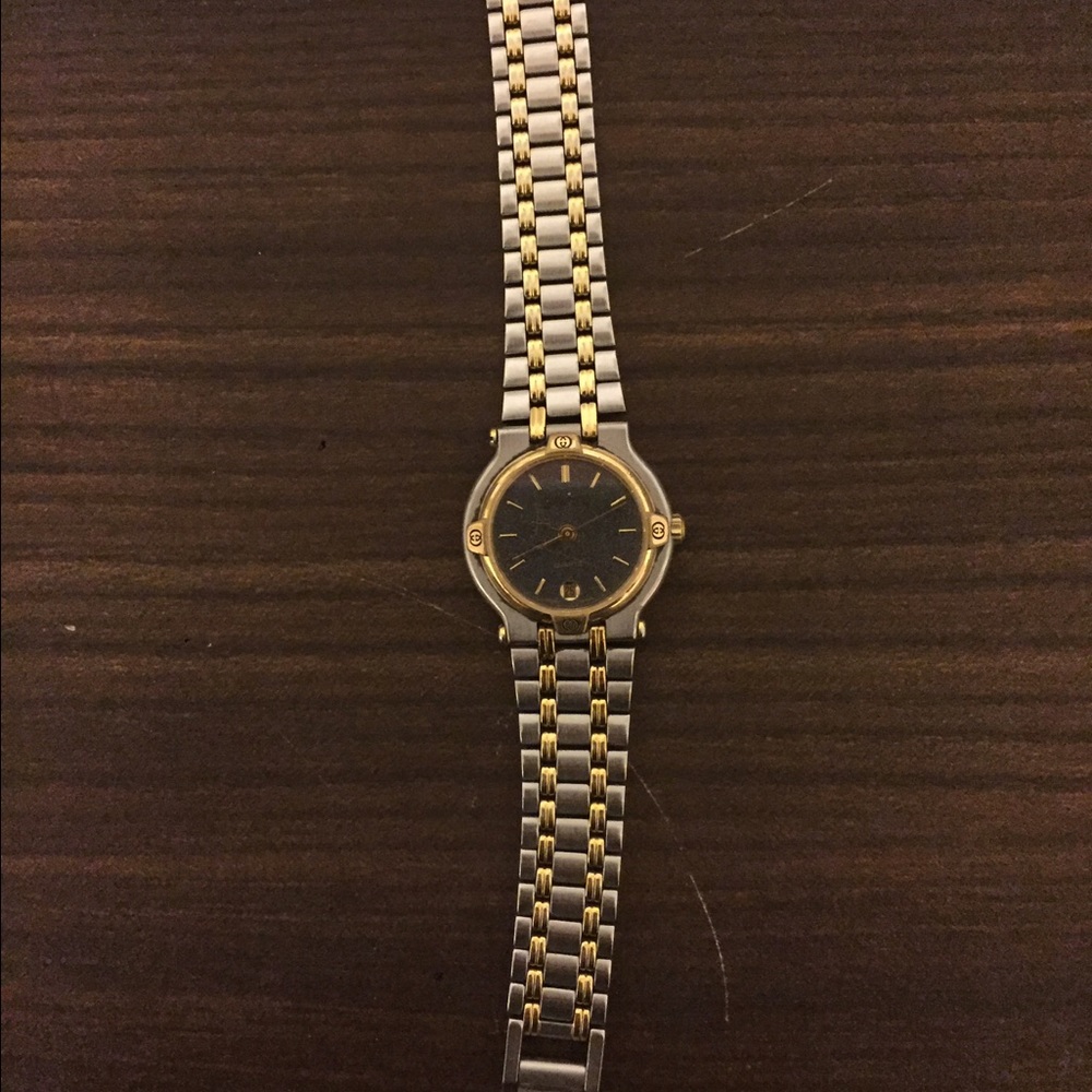 Gucci two toned watch with black face