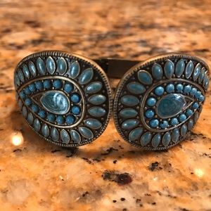 Gold tone bracelet with blue stones