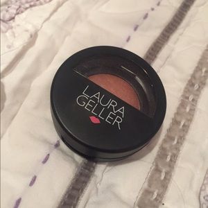 Mini Laura Geller baked blush in "pink grapefruit"