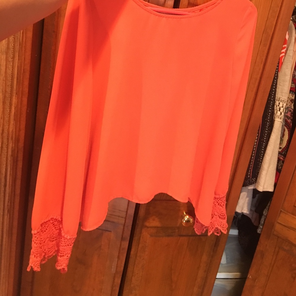 Salmon colored long sleeved top