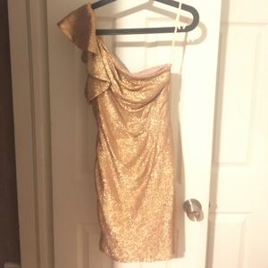 One shoulder gold dress by Adriana Papell