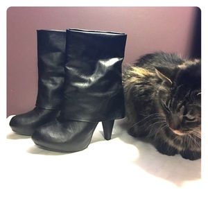 High heeled black mid calf boots