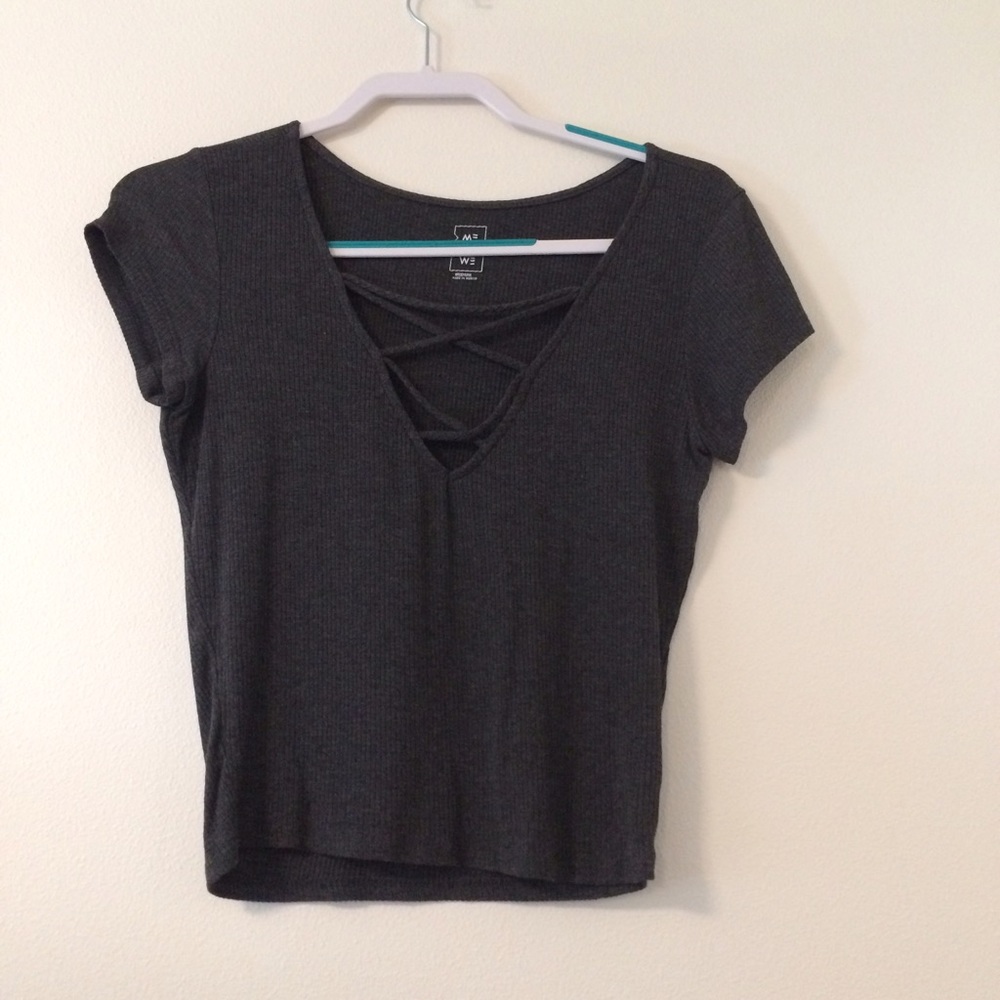 A tight criss cross, crop top.