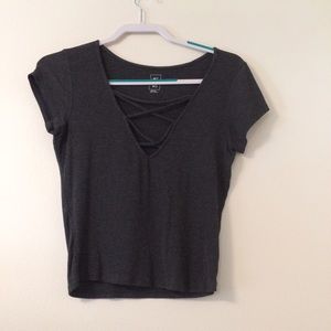 A tight criss cross, crop top.