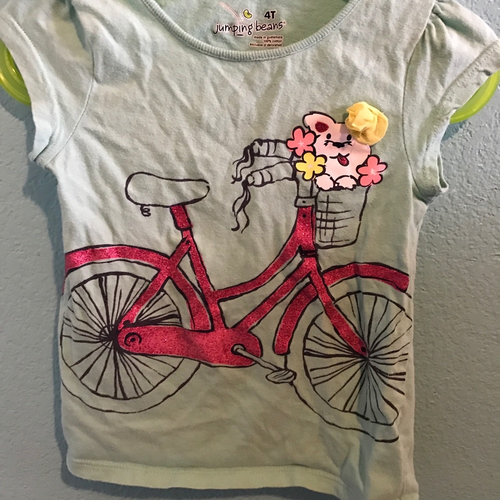 Blue top with puppy on bike