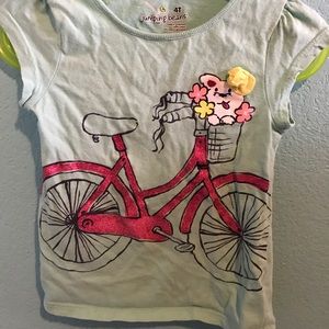 Blue top with puppy on bike