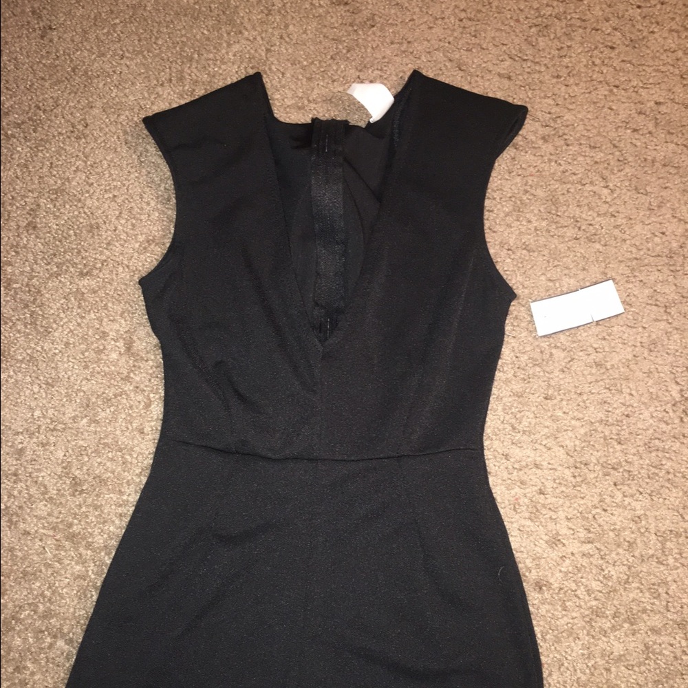Never worn classy simple black romper