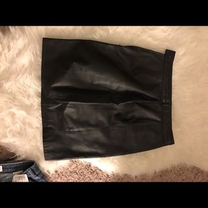 Tight black leather skirt