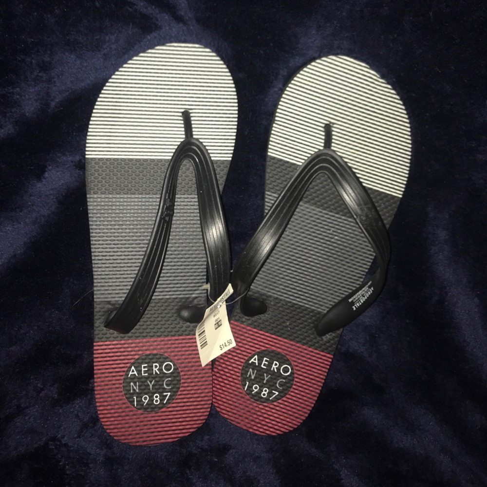 Red, Black, White, and Grey Flip Flops