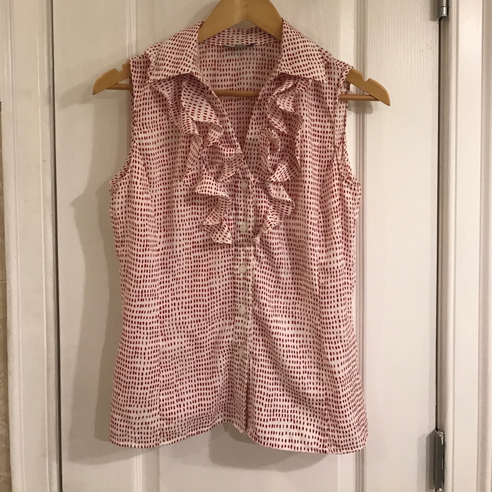 Red and white sleeveless dotted button up