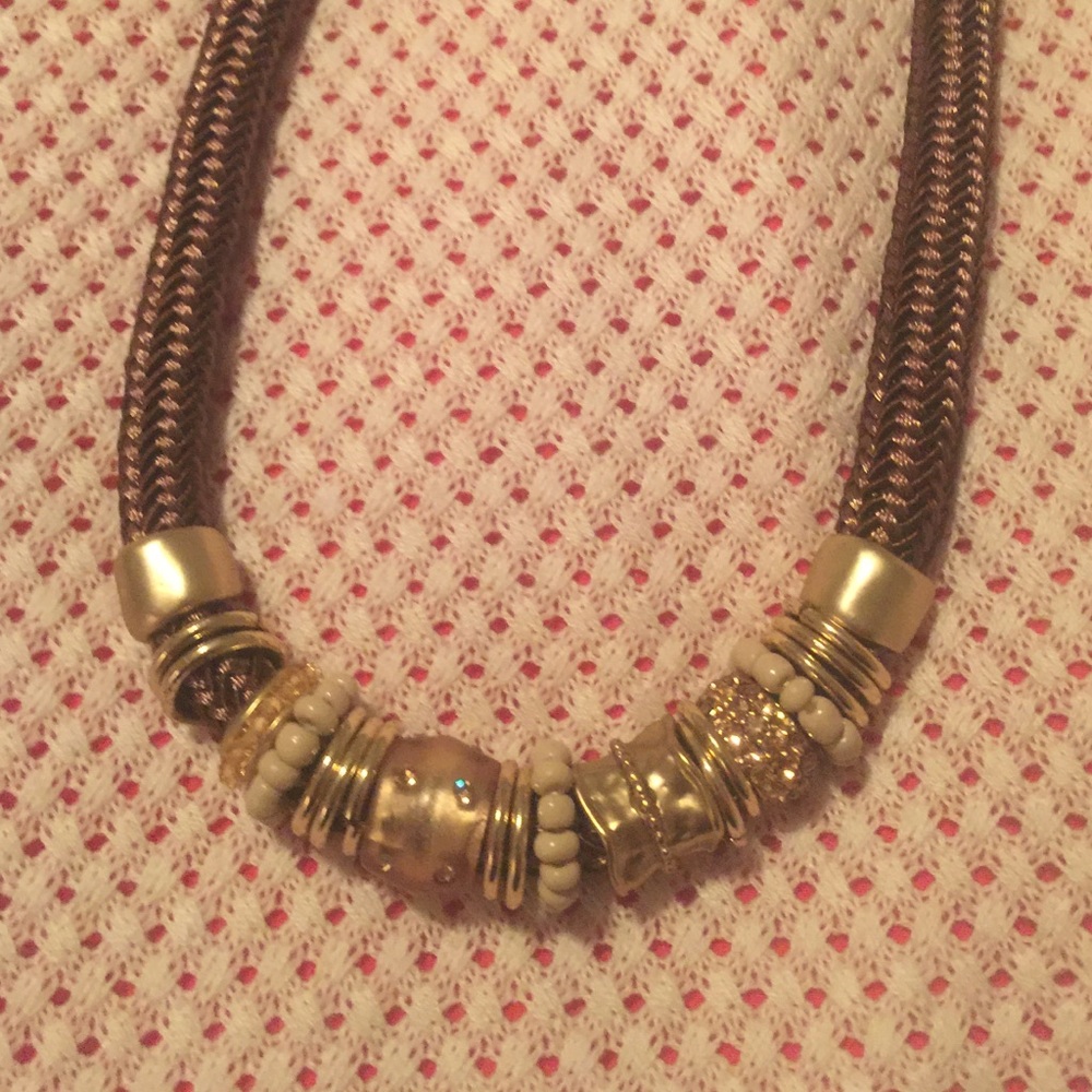 Brown mesh with barrel beads and gold tone .