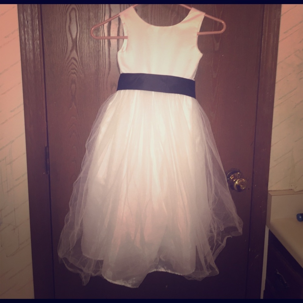 Girls white dress with a black bow