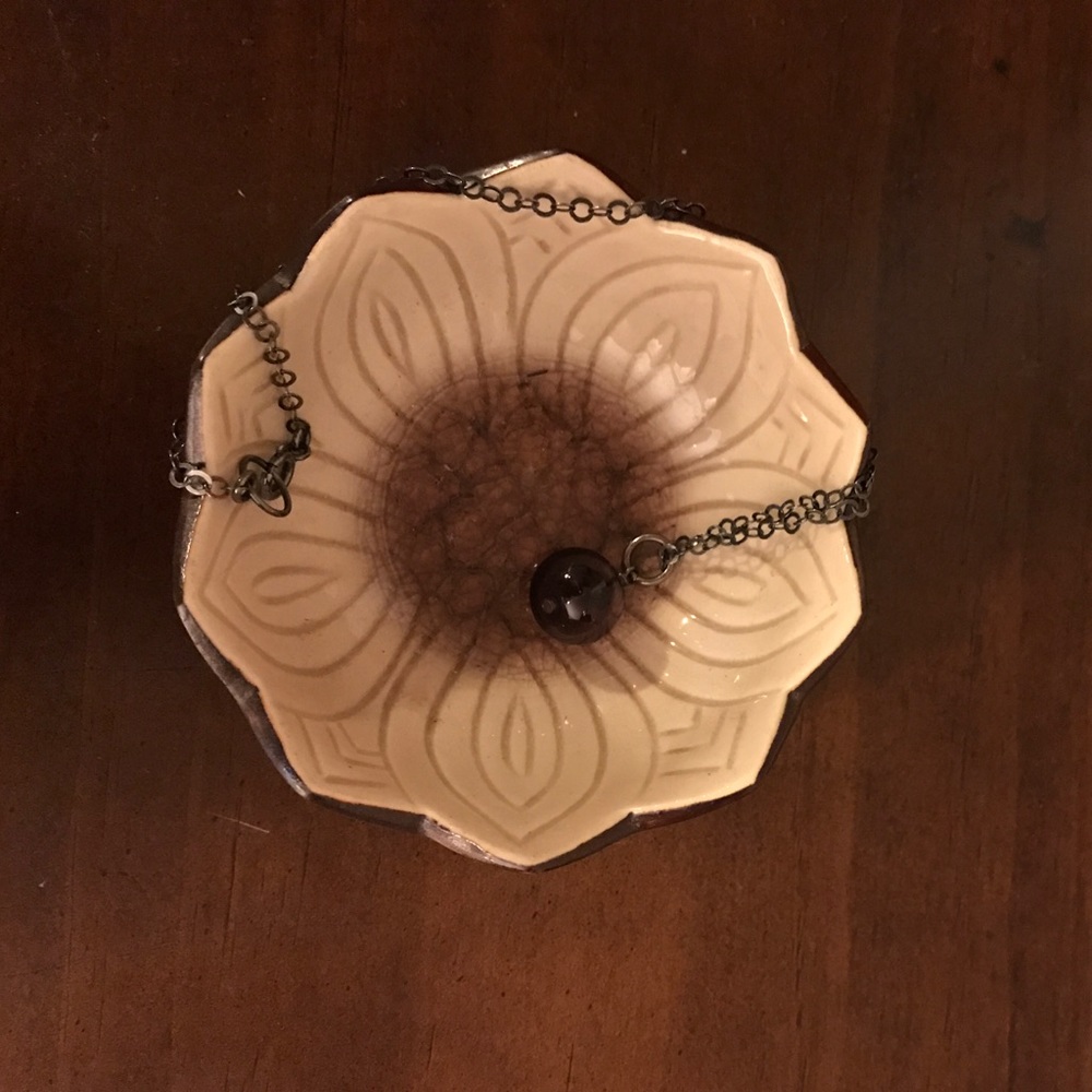 Necklace with purple glass pendant
