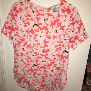 Orange and white floral print blouse