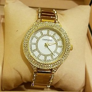 Women's gold studded watch.