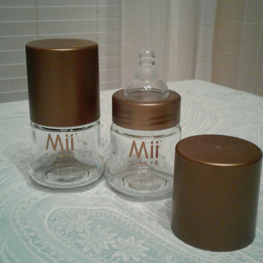 A set of 2 MII  GLASS bottles