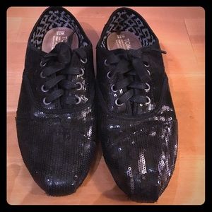 Lightly worn black sparkle Toms tennis shoes