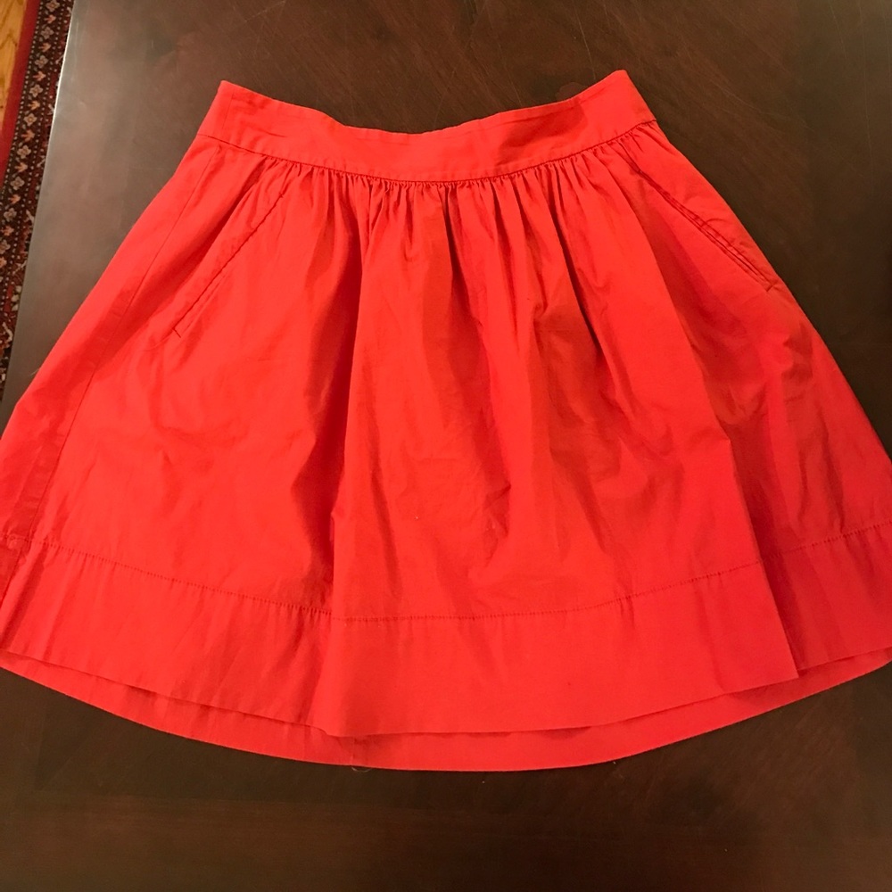 Full knee length red skirt