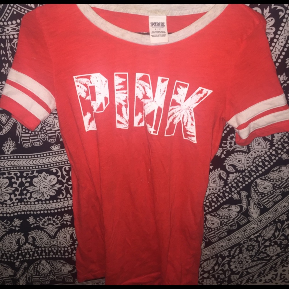 orange shirt with pink on it