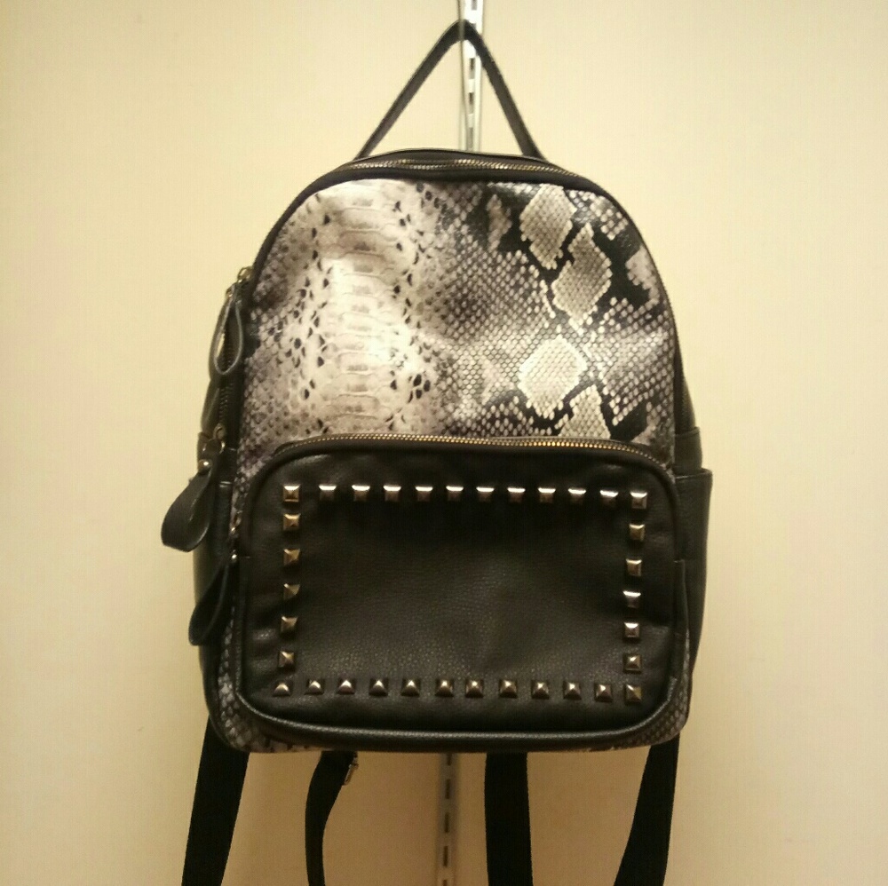 Black and pattern leather backpack
