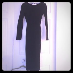 Body hugging calf length long sleeve dress.