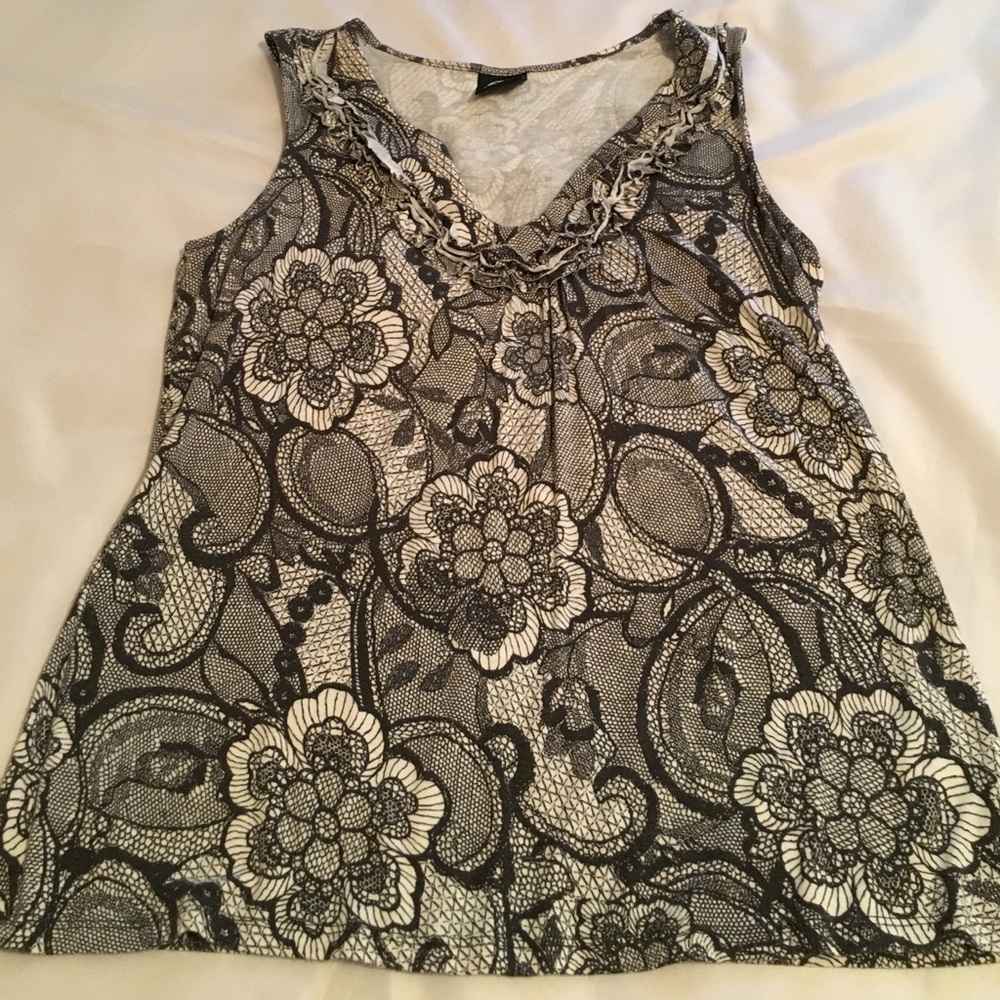 Lovely v-neck sleeveless top in 100% rayon.